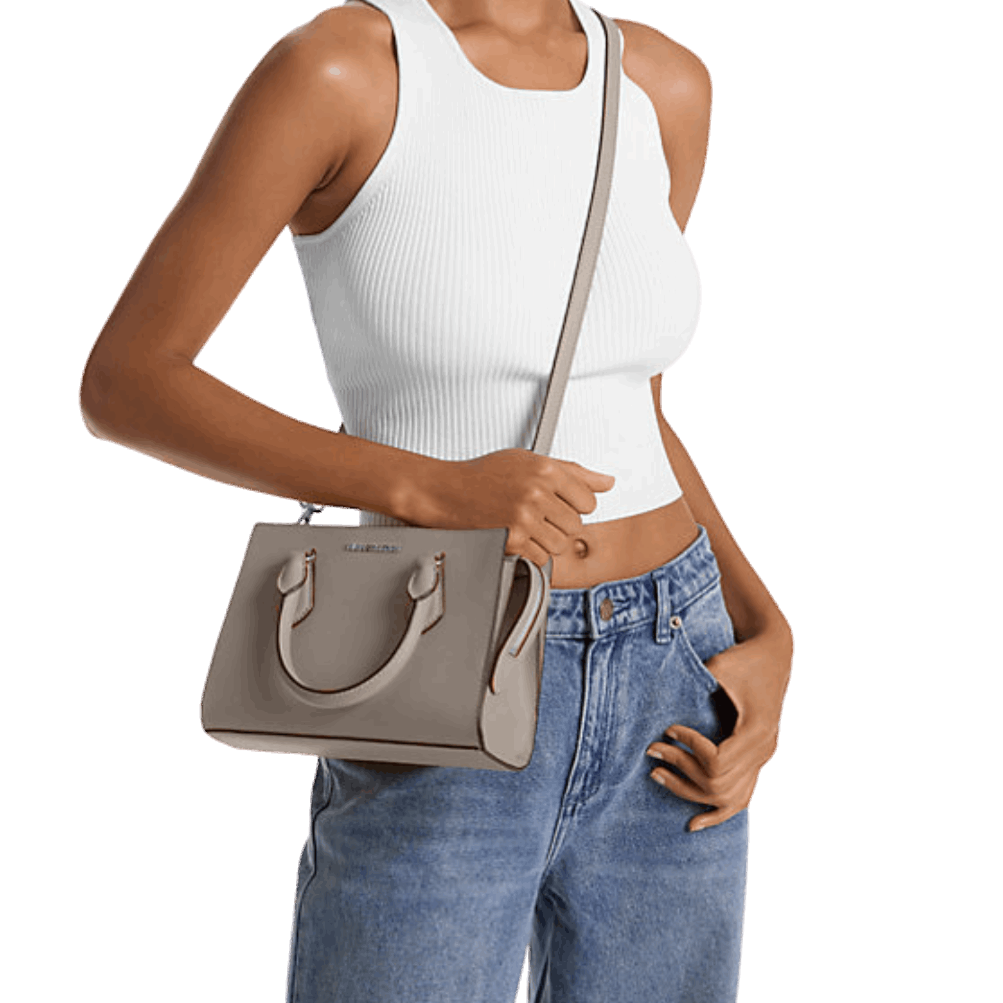 Person wearing a white tank top and blue jeans holding a gray handbag.